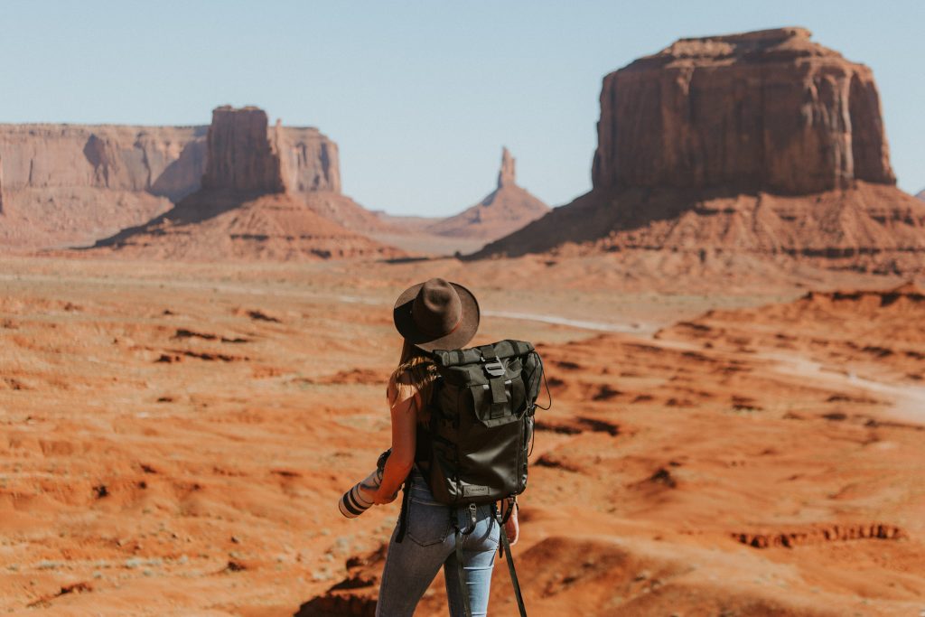 Female backpacker travelling in a desert