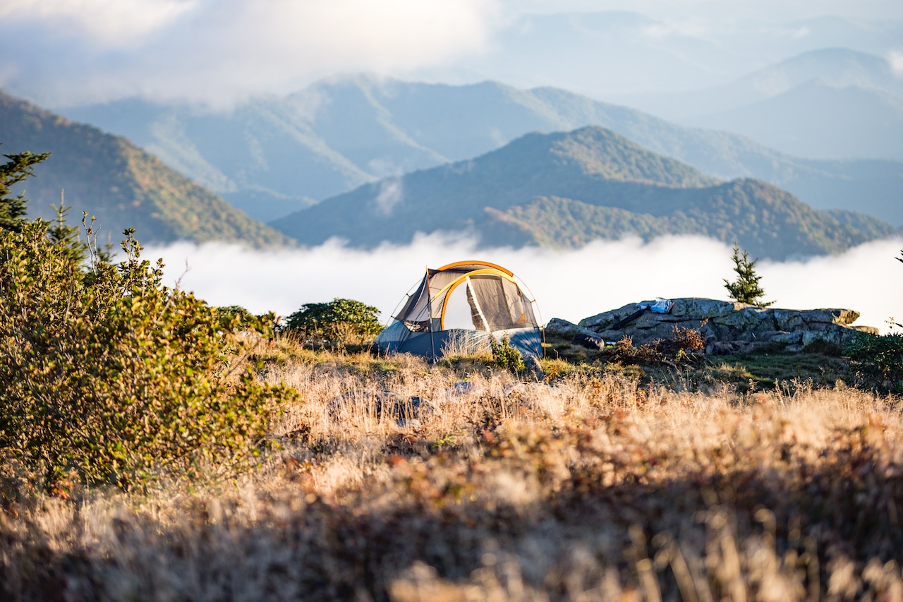 A camping tent set on top of a mountain