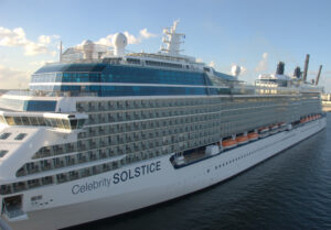 A white cruise ship with a label saying Celebrity SOLSCTICE.