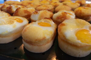 Steamed breads with sunny side-up on top.