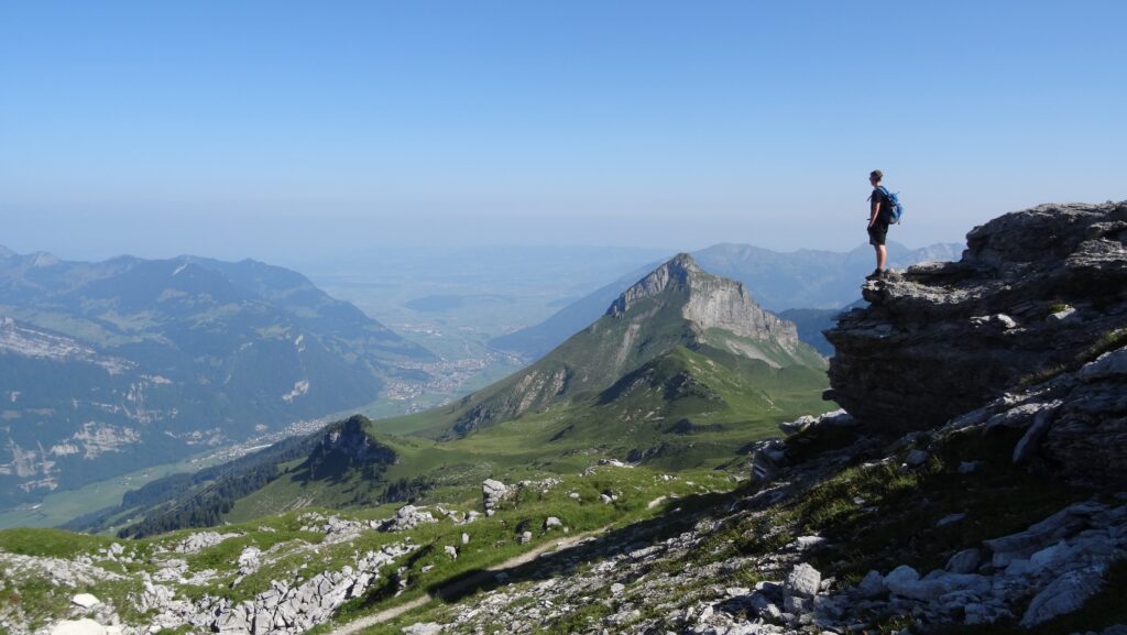 A man standing near a cliff.