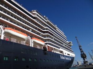 A docked cruise ship with a label that says Holland America Line.