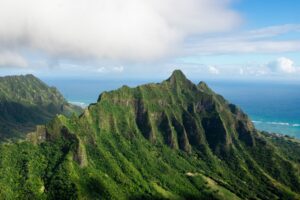 Green mountains overlooking the sea in the Jurassic Park Hawaii.