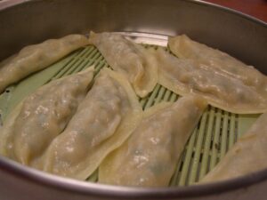 Korean dumplings or mandu inside a steamer.