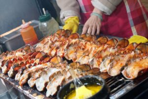 Fresh lobsters grilled with melted cheese.