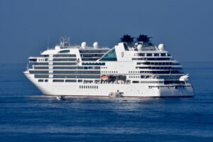 A white cruise ship in the open water.