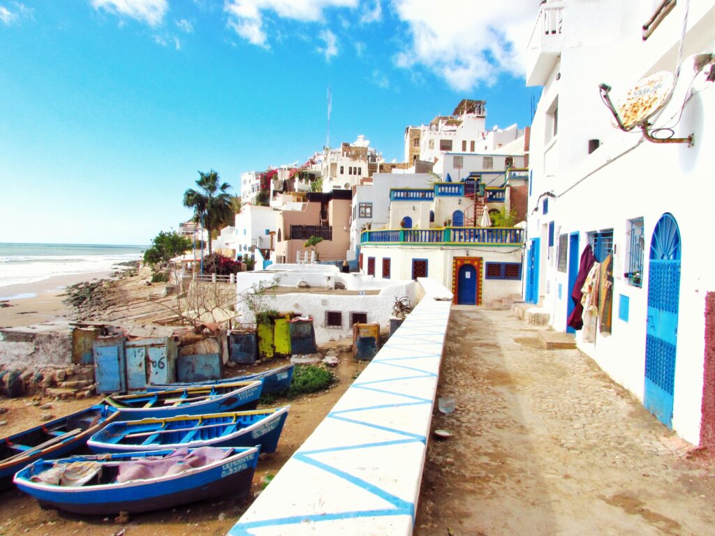 Boats docked near traditional Moroccan houses