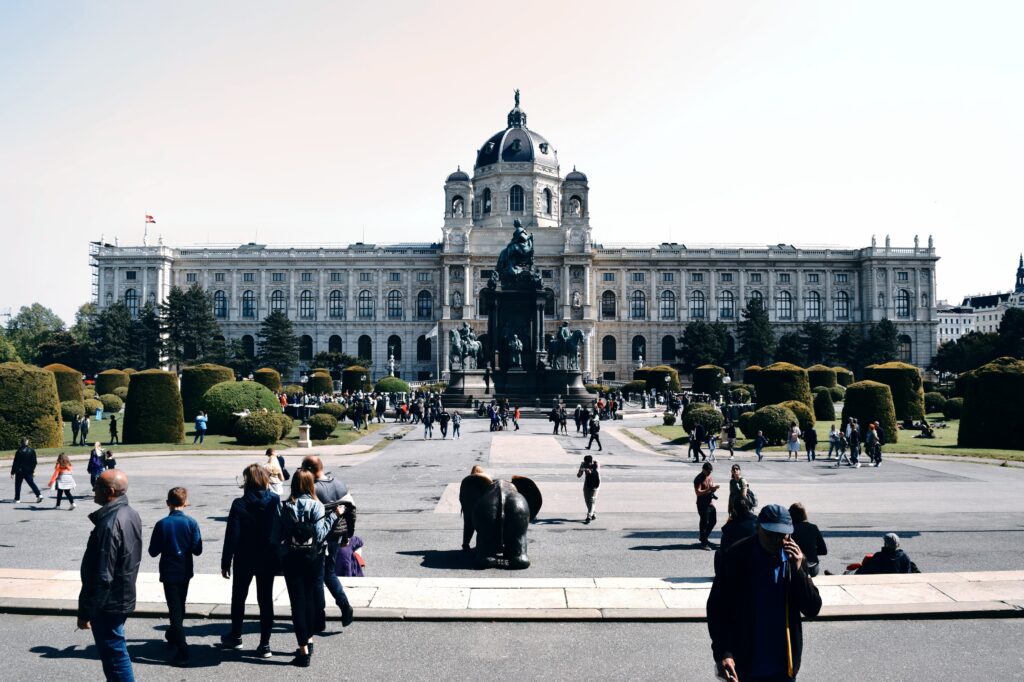 People Walking in front of Natural History Museum in Vienna.