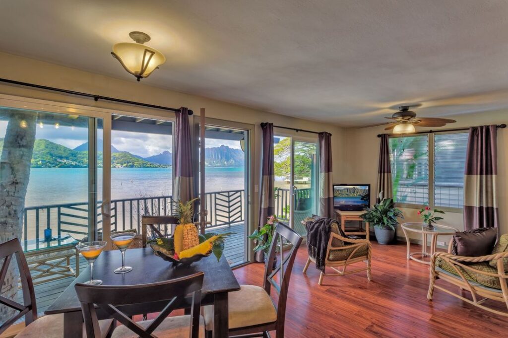 A lounge room with a waterfront view.