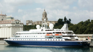 A ship with a label "SeaDream Yacht Club" and a bell tower from behind.