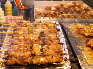 Spicy chicken skewers sold in streets of Seoul.