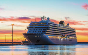 A cruise ship moored in the harbor of Sète (Hérault, France) during sunset.