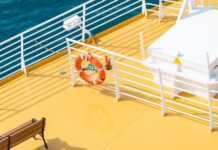 Overview of a cruise ship deck painted in white and yellow.