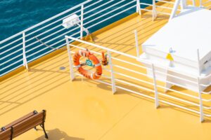 Overview of a cruise ship deck painted in white and yellow.