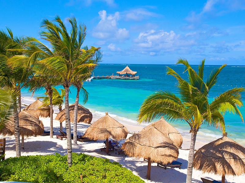 Beach view of the Desire Riviera Maya Pearl Resort in Mexico on powdery white sand beach