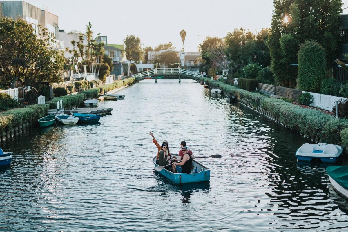 Friends kayaking in LA Venice Canals 