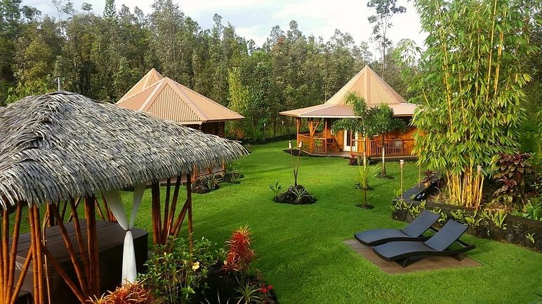 Lush greenery at the Volcano Mens Retreat Hawaii with Gazebos surrounding the outdoor area.