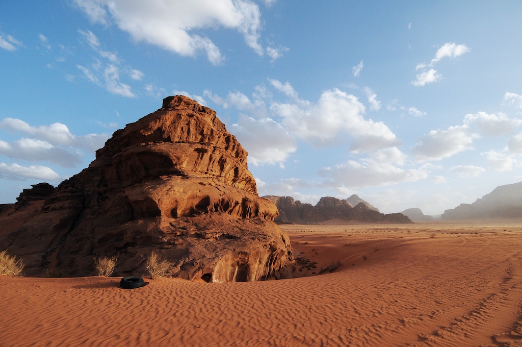 Wadi Rum panoramic landscape view with red sand desert during the day