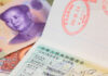 Chinese Visa with Chinese yuan bank note as a background