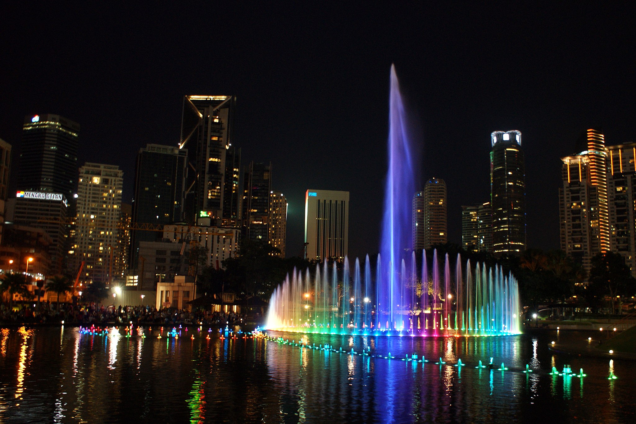 Light show at the Lake Symphony of KLCC Park during the night.