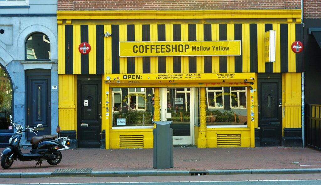 A storefront painted in black and yellow stripes.