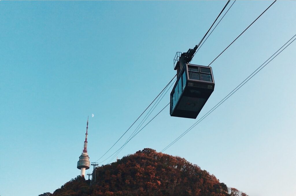 A cable car approaching a tower.