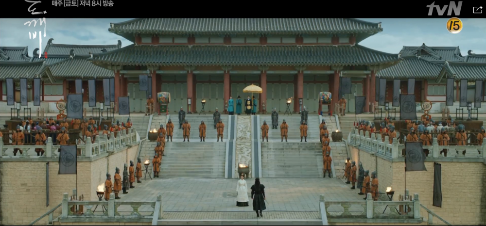 People standing around a Korean Palace.
