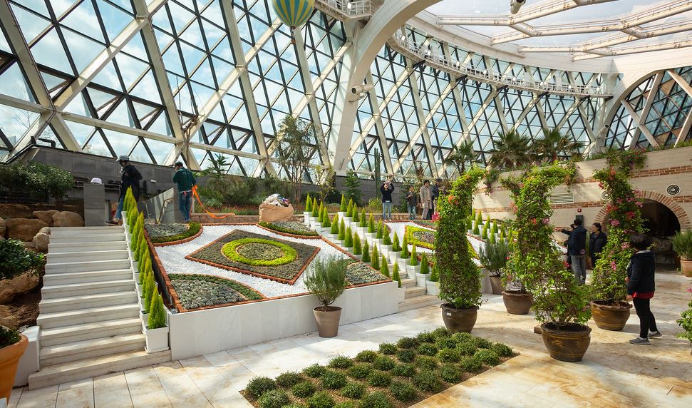 People walking in an indoor garden in Seoul.