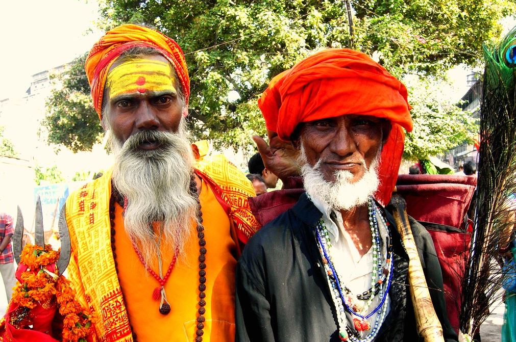 A Muslim and a Hindu poses for a photo.