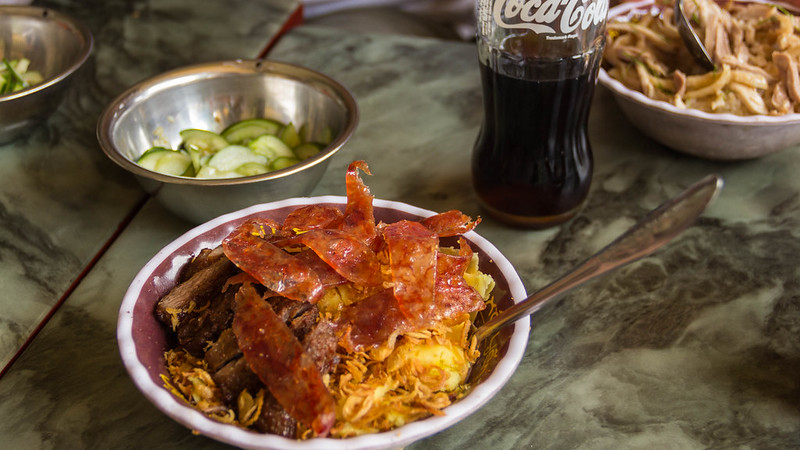 Vietnamese sticky rice in a bowl with fried pork and pork skin cracklings