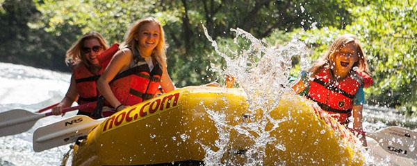 Group of girls whitewater rafting, and kayaking in Gatlinburg