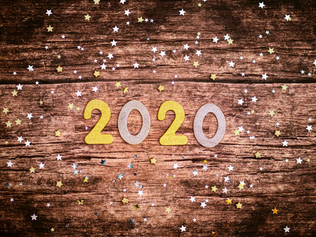 2020 sign on a wooden platform.
