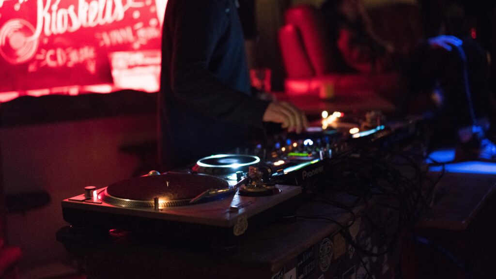 Person using a DJ controller.